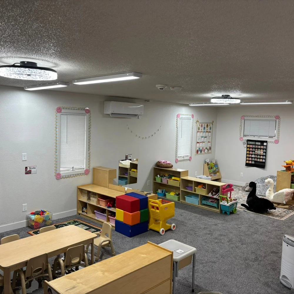 Chickadees play room with soft blocks, toy shelves, learning charts, and a carpeted play area